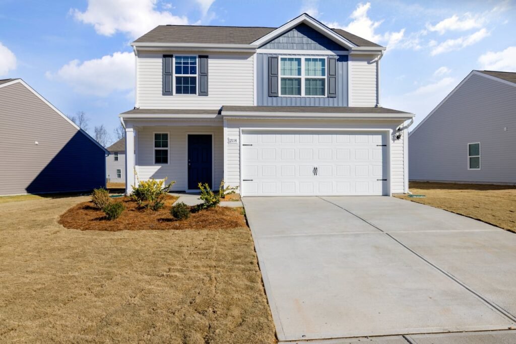 White and Blue House Under Blue Sky fix by Garage Door Repair Rumson, NJ